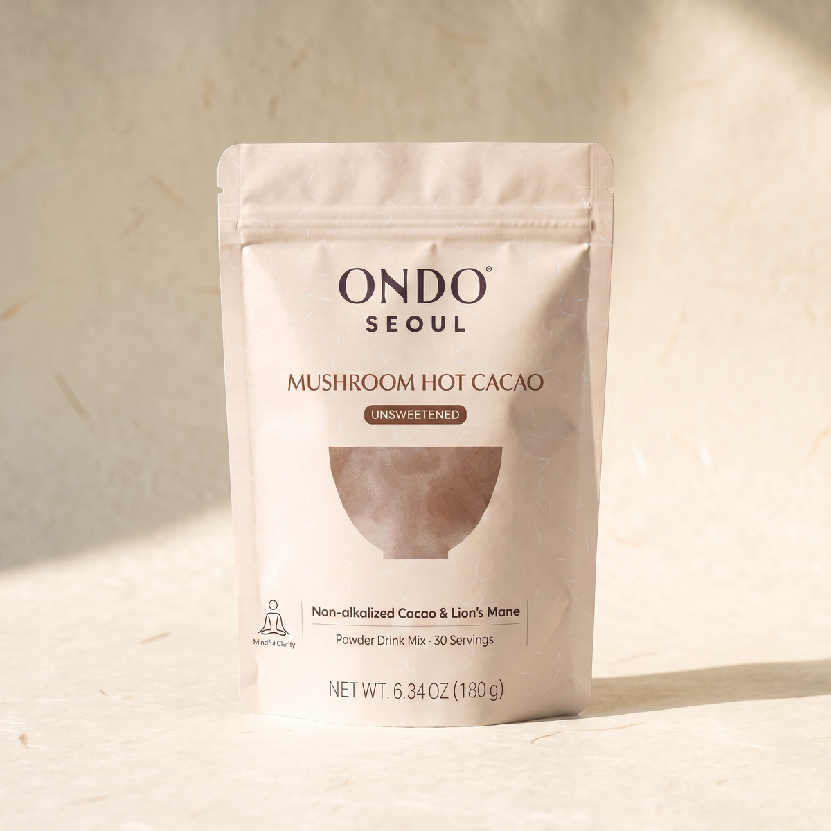 Focus Mushroom Hot Cacao (Unsweetened) pouch, front view, on ivory hanji paper.
