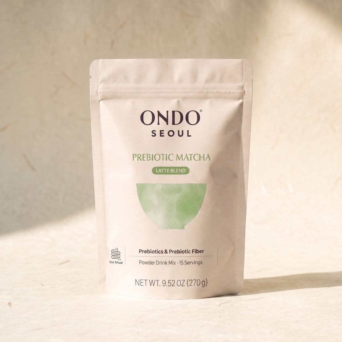 Prebiotic Matcha (Latte Blend) pouch, front view, on ivory hanji paper.